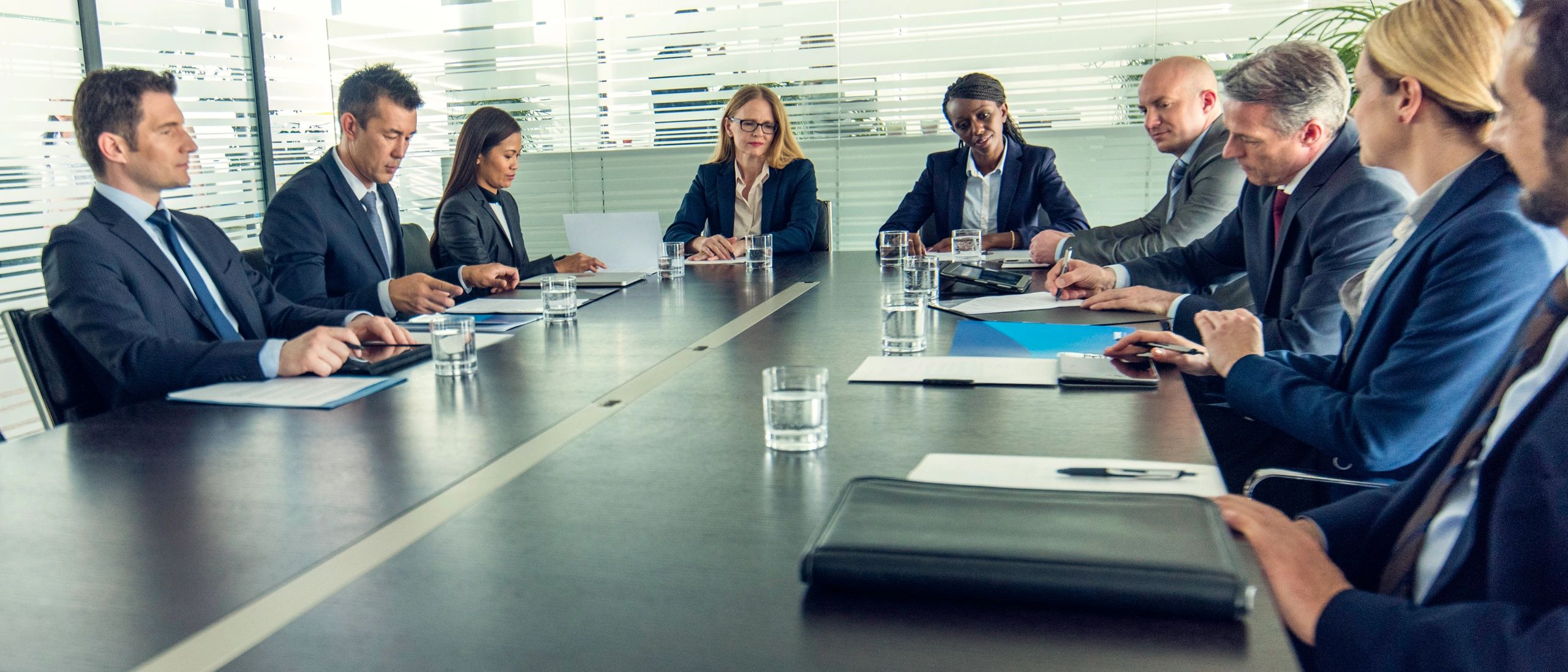 Senior leaders in a confidential advisory meeting